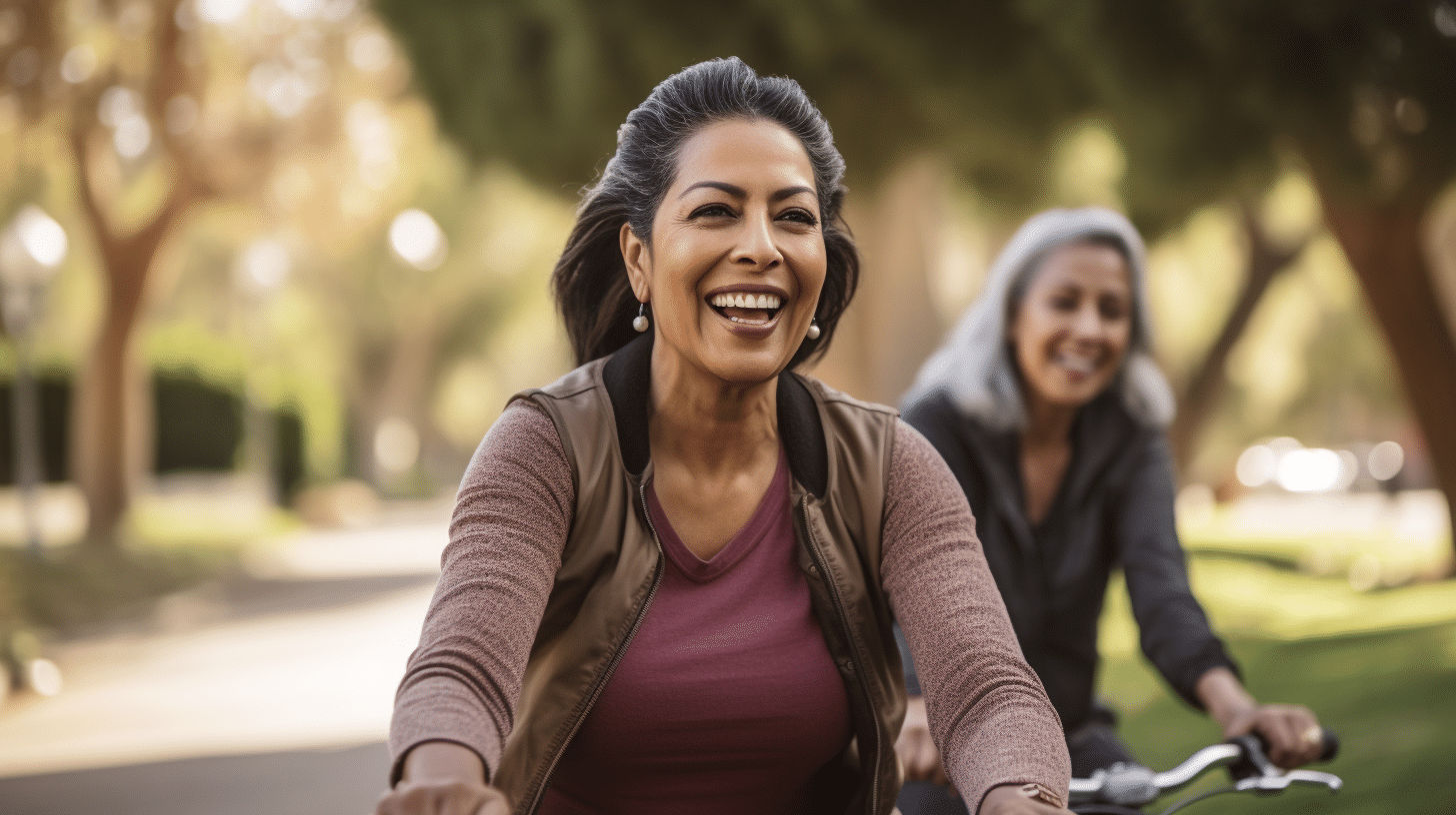 A Hispanic woman in her 40s biking the park together with her friend.