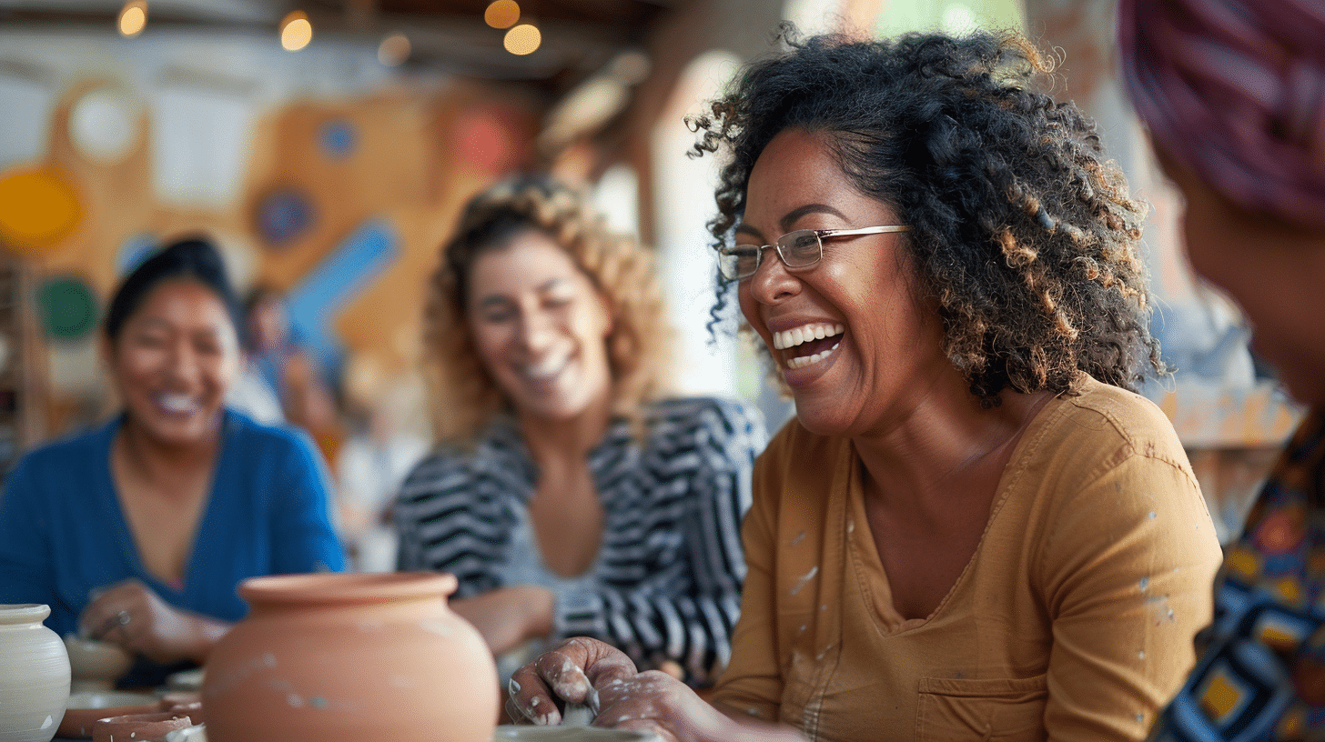 A group of multiracial women participating in a pottery class.