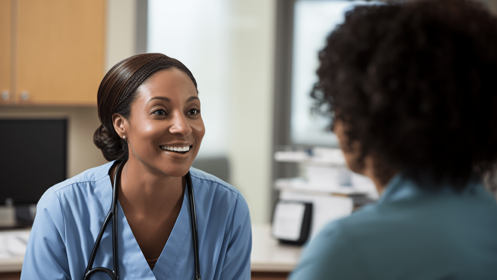 nurse practitioner talking to a patient in a clinic.