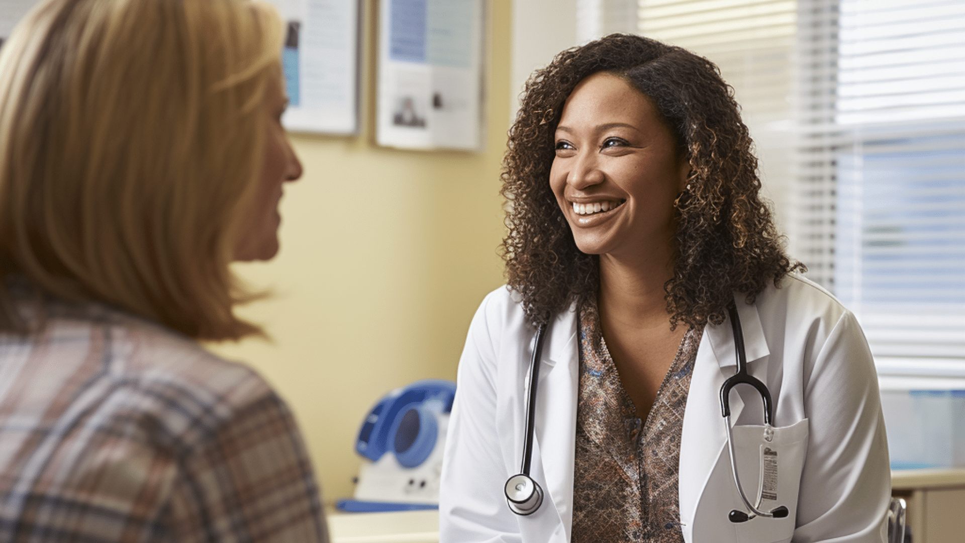 a smiling medical doctor talking to her patient about patient testimonials.