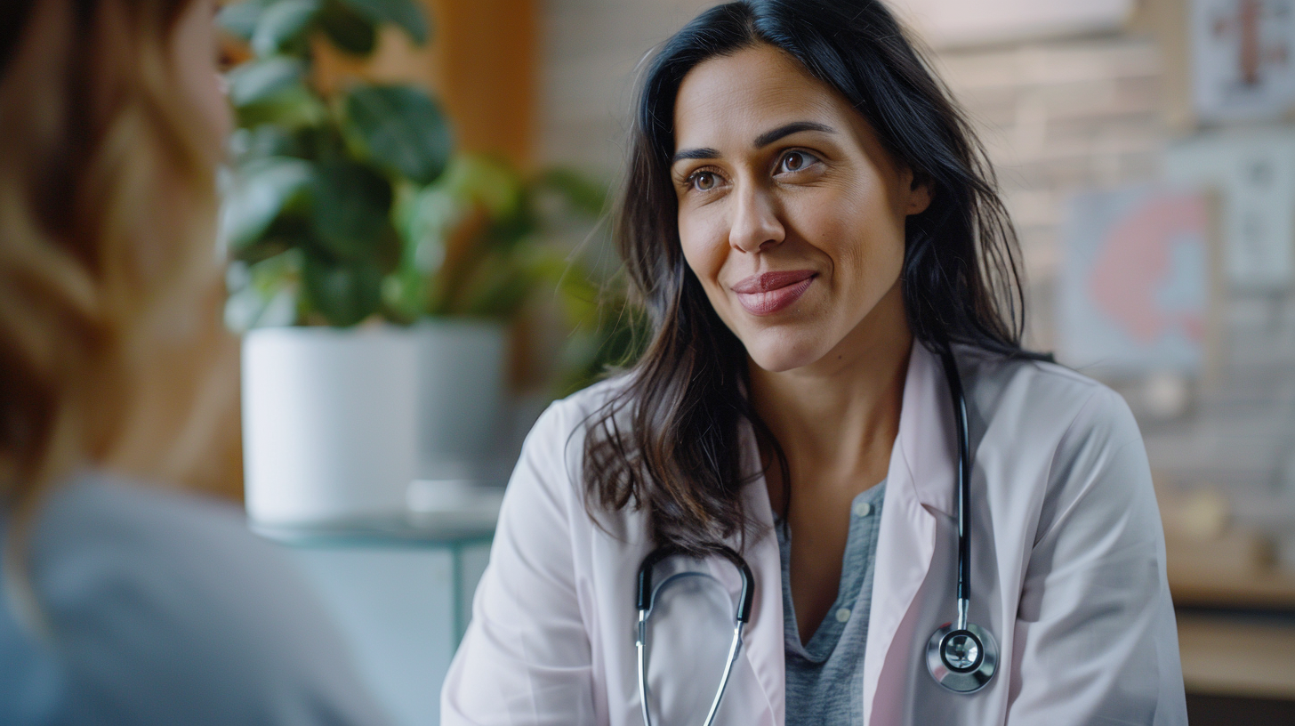 A woman doctor talking with patient in a clinic.