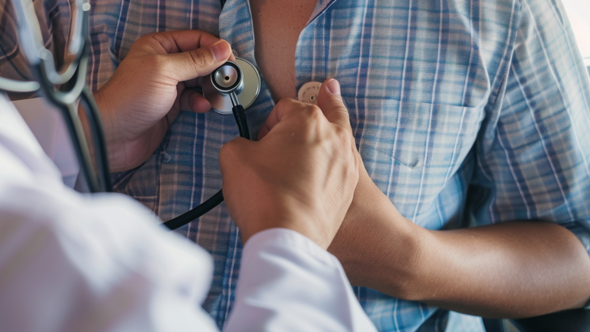 A doctor is using a stethoscope to examine a patient's chest in a clinic.