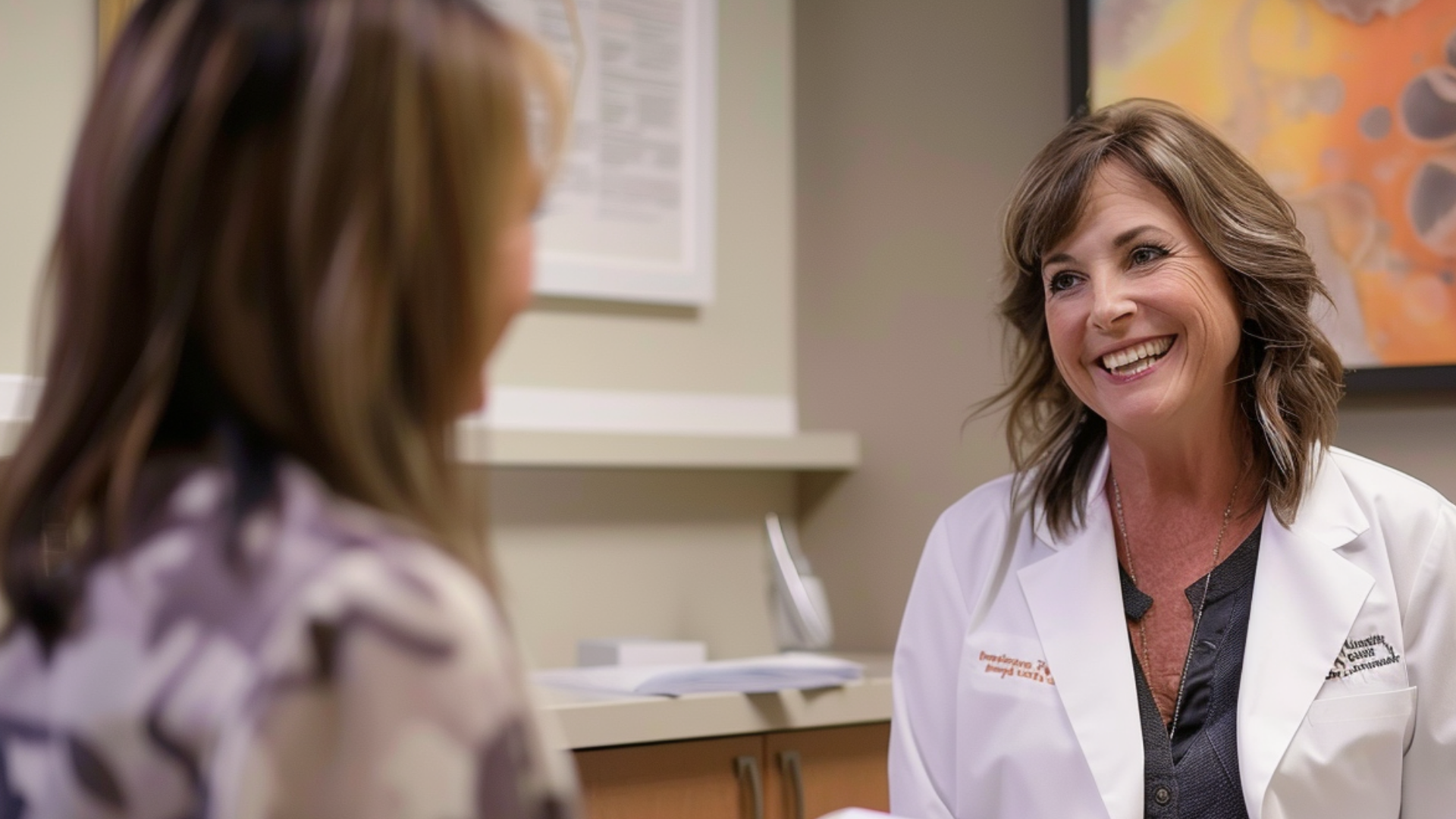 A medical doctor engaged in a conversation with her patient.