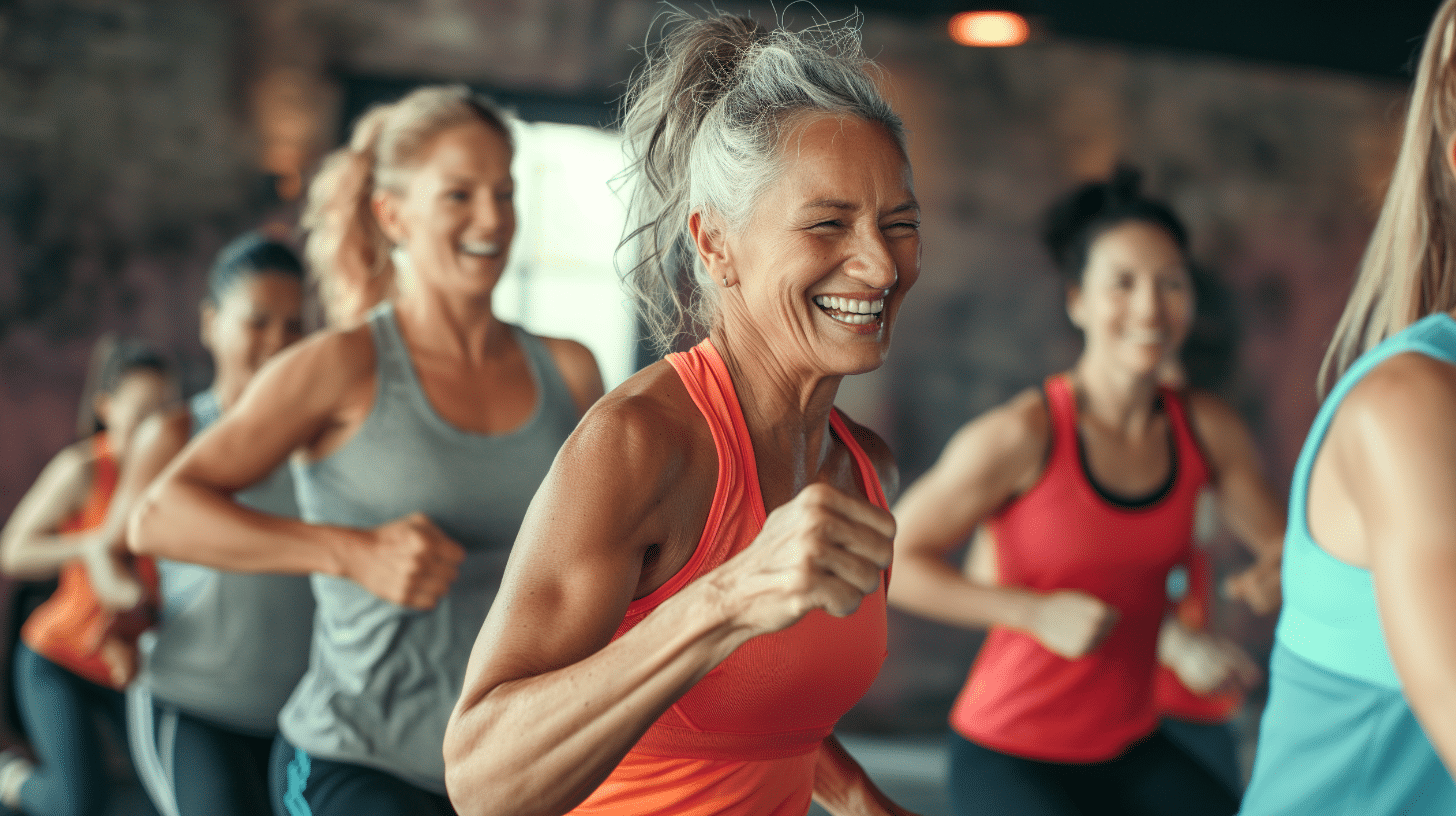 A Hispanic woman in her 50's doing aerobics exercises in a studio.