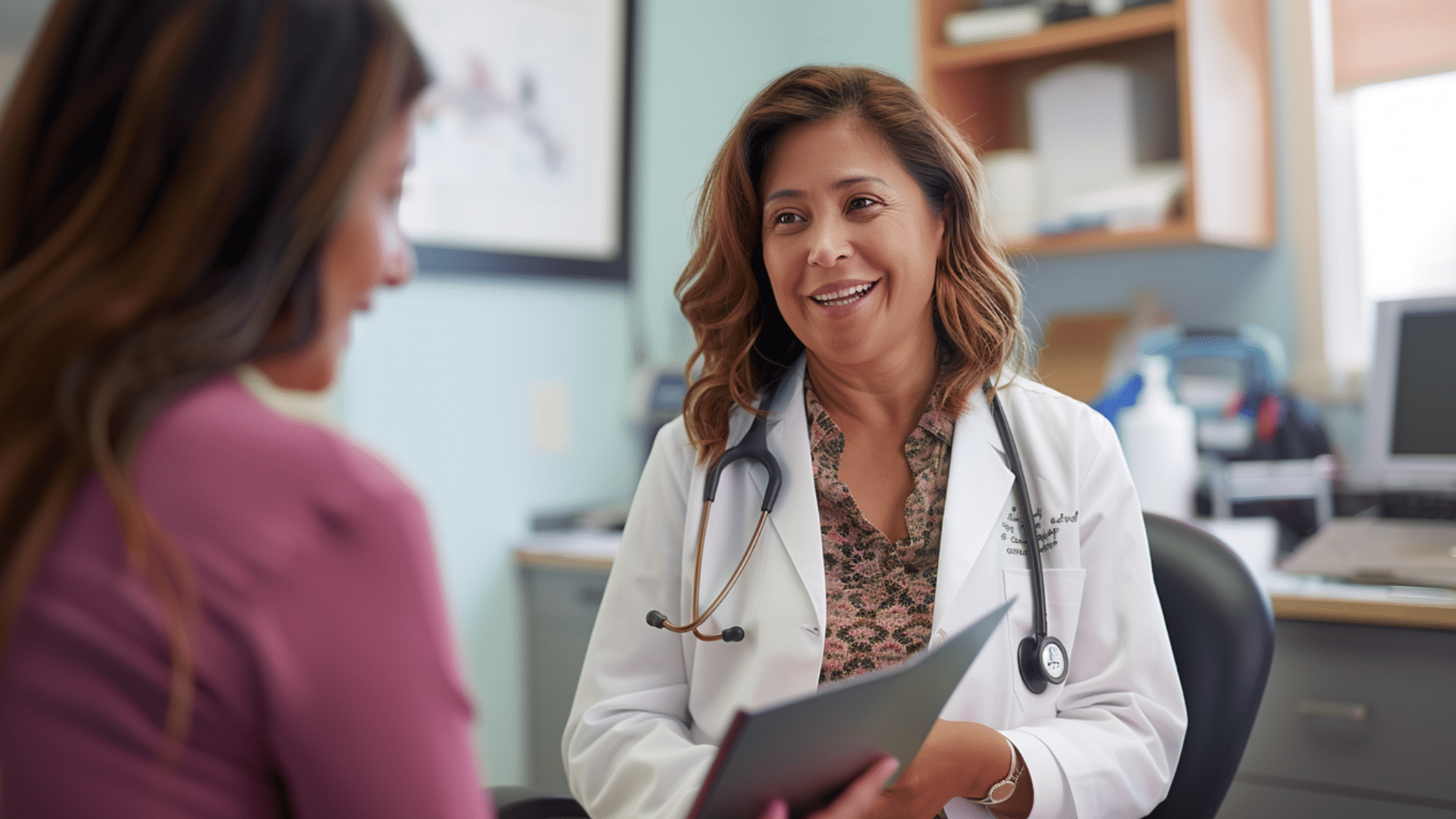 A doctor happily talking with her patient.