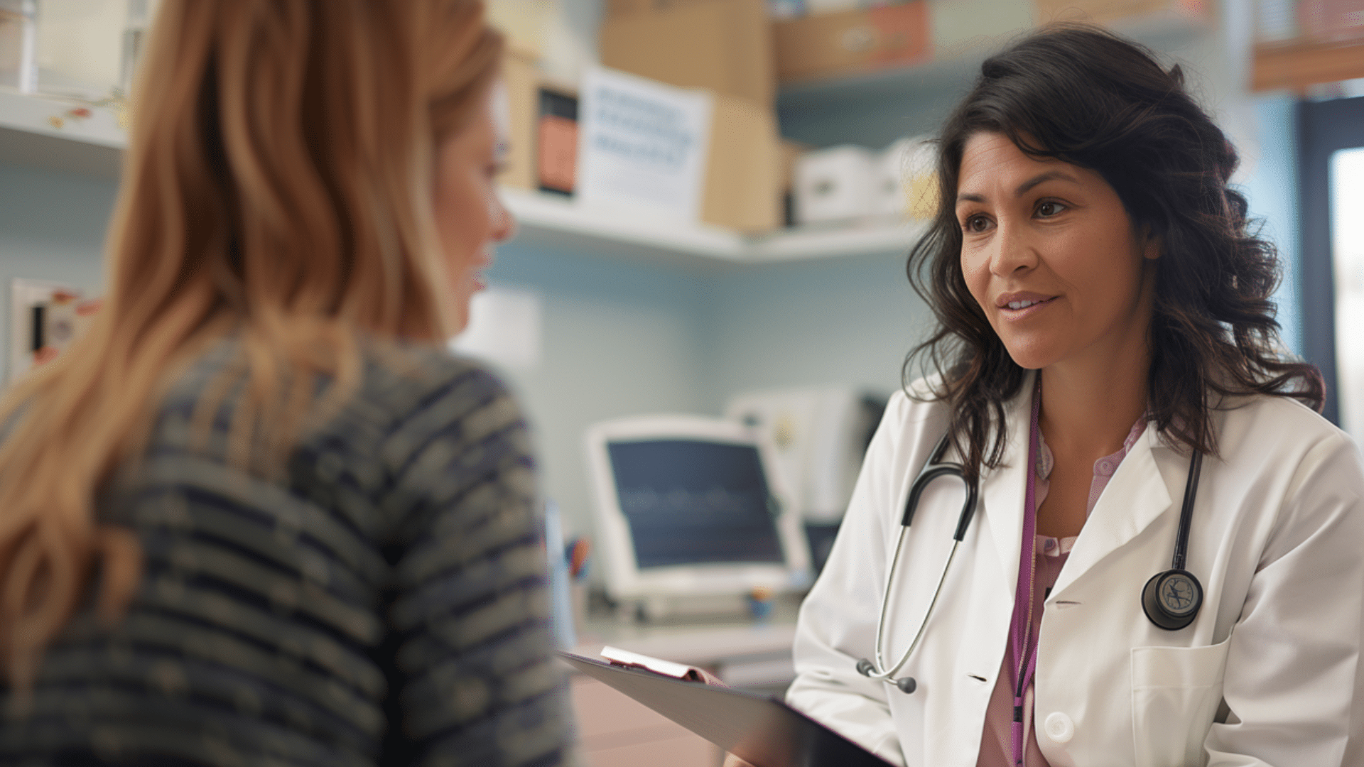 A doctor happily talking with her patient.