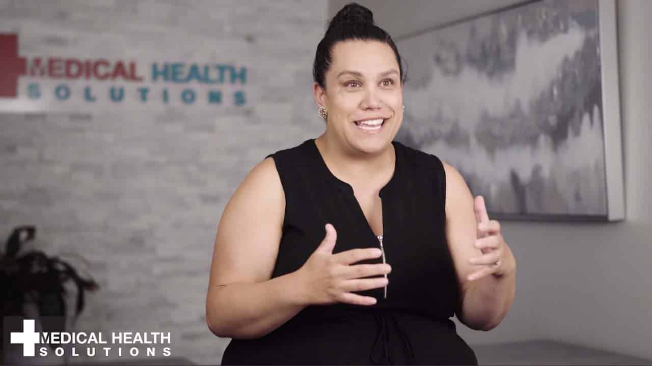 This is Courtney who lost 50 pounds at Medical Health Solutions weight loss clinic. In this photo she is sitting inside the clinic.