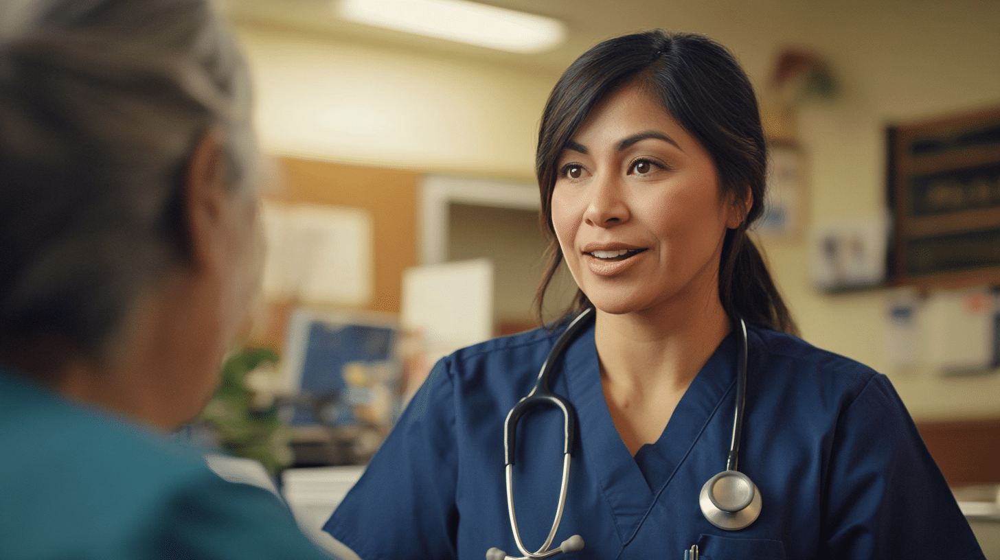 A nurse practitioner talking to a patient in a clinic setting. Show a friendly consultant wearing a blue scrub interacting with a client in a comfortable, well-designed consultation room.