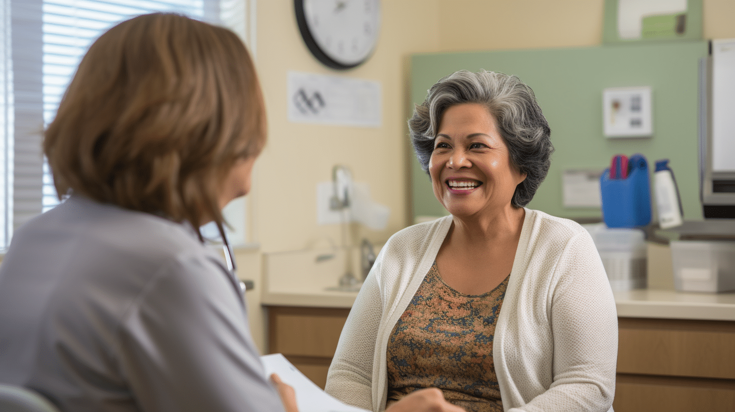 A Hispanic female patient in her 60's who is overweight is talking with a nurse in a medical clinic. The nurse is holding a chart.